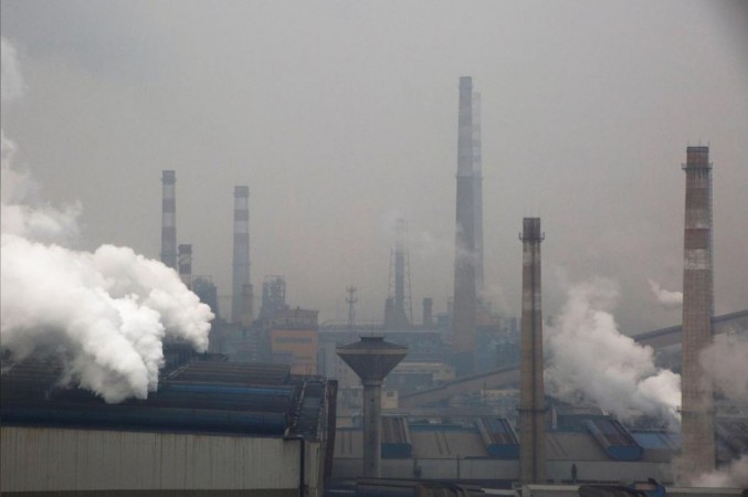 Smoke and steam rise from a steel plant in Anyang, Henan province, China, February 18, 2019. China emissions