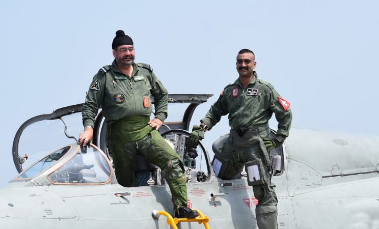 IAF Chief Air Chief Marshal BS Dhanoa poses for a photograph with Wing Commander Abhinandan Varthaman before they conducted a joint sortie on MiG-21 fighter plane from the Pathankot Air Force Base. IAF chief BS Dhanoa with Wing Commander Abhinandan Varthaman on MiG-21