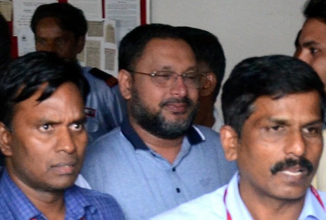 IMA Jewellers' founder and prime accused in the multi-crore Ponzi scam Mansoor Khan being taken to be produced before a Prevention of Money Laundering Act (PMLA) court in Bengaluru on July 20, 2019. Mansoor Khan