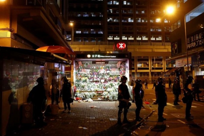 Riot police officers stand outside Prince Edward MTR station, where people laid down flowers after a protest to demand an investigation after members of the police's Special Tactical Squad stormed a train and arrested several dozens of people on August 31, in Hong Kong, China September 6, 2019. Hong Kong police