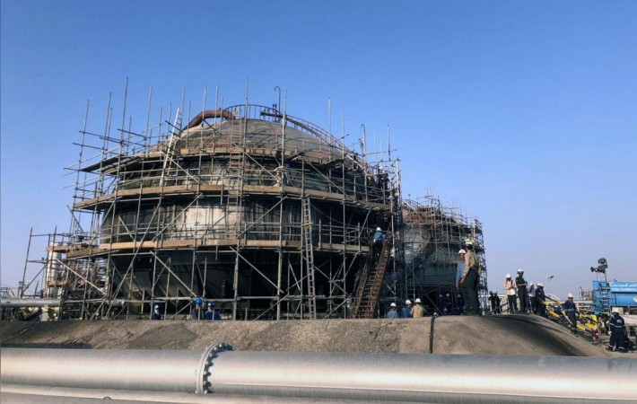 Workers are seen at the damaged site of the Saudi Aramco oil facility in Abqaiq, Saudi Arabia, September 20, 2019. Damaged Aramco oil facilitiy