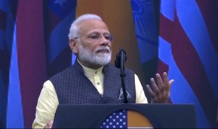 The entire audience of 50,000 stood up and applauded in unison. PM Modi
