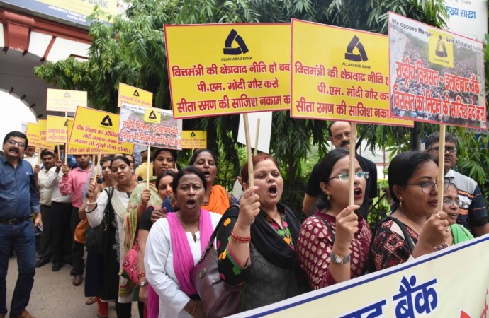 Employees of Allahabad Bank stage a demonstration against Prime Minister Narendra Modi and Union Finance and Corporate Affairs Minister Nirmala Sitharaman over the bank's merger with Indian Bank, in Patna. Bank merger protest
