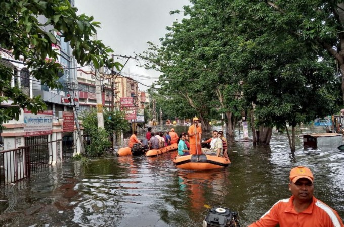 Rescue members evacuate people from a flood-affected neighbourhood in Patna, in the eastern state of Bihar, India, October 1, 2019. Monsoon rains