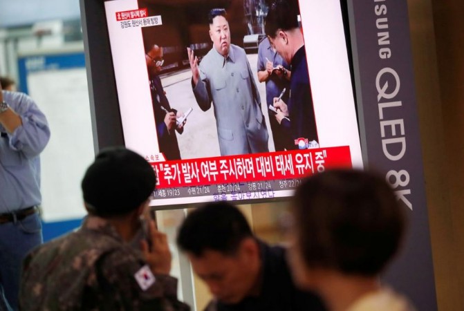 A South Korean soldier watches a TV showing a file footage for a news report on North Korea firing a missile that is believed to be launched from a submarine, in Seoul, South Korea, October 2, 2019. north korean submarine missile launch