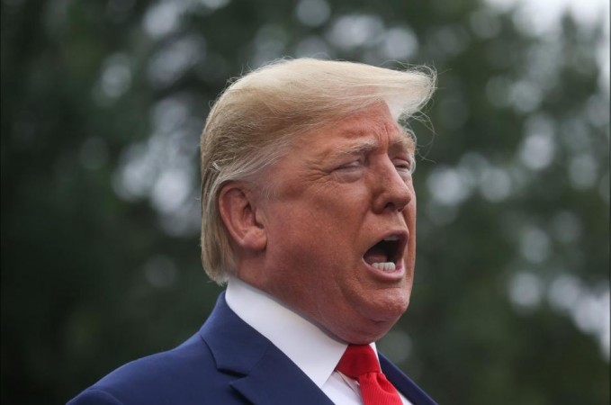 US President Donald Trump talks to reporters as he departs for travel to Florida from the South Lawn of the White House in Washington, US, October 3, 2019. US President Donald Trump