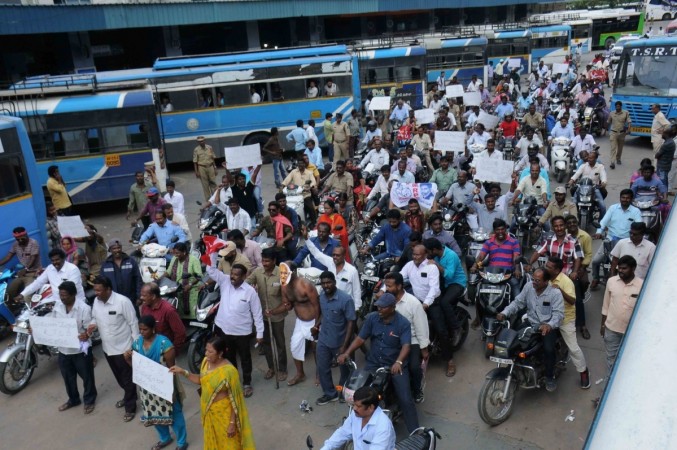 On 15th day of the transport strike, employees along with leaders and activists of opposition parties, trade unions, teachers and workers took to streets to protest what they call 'dictatorial' attitude of CM K Chandrashekhar Rao. Telangana transport strike