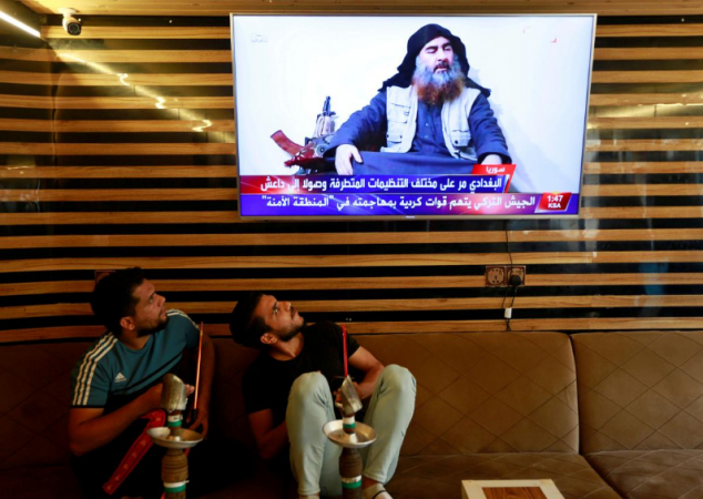 Iraqi youth watch the news of Islamic State leader Abu Bakr al-Baghdadi death. Abu Bakr al-Baghdadi death