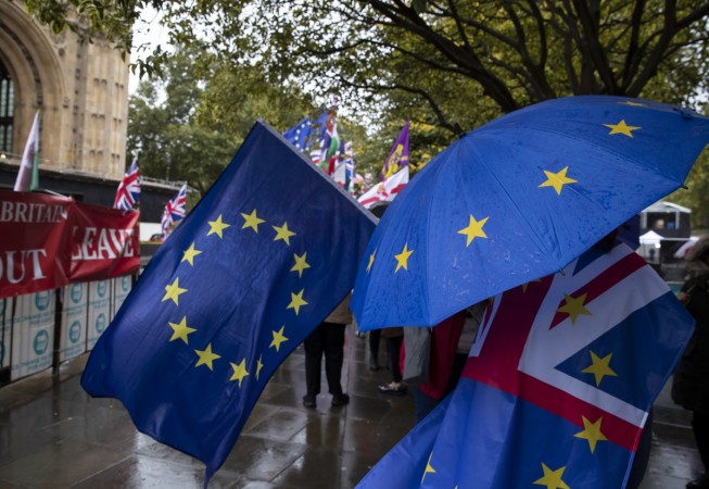 Protestors demonstrate outside the Houses of Parliament in London, Britain. Brexit