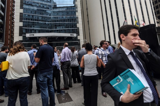 People gather outdoors after sensing an earthquake in Sao Paulo, Brazil, on April 2, 2018. Bolivia's earthquake on Monday was felt as far away as Brazilian city of Sao Paulo, where residents and office workers spilled into the streets. The quake measuring 6.8 on the Richter scale struck southern Bolivia's Chuquisaca department at 9:40 a.m. local time (13:40 GMT), the U.S. Geological Survey (USGS) said. workforce