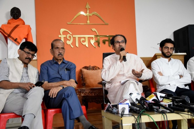 Shiv Sena chief Uddhav Thackeray addresses a press conference in Mumbai with leaders Aaditya Thackeray and Sanjay Raut. Shiv Sena