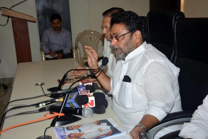 NCP spokesperson Nawab Malik addresses a press conference in Mumbai. NCP