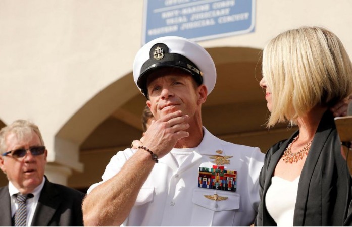US Navy SEAL Special Operations Chief Edward Gallagher prepares to answer a question from the media with wife Andrea Gallagher after being acquitted on most of the serious charges against him during his court-martial trial at Naval Base San Diego in San Diego, California, US, July 2, 2019. US war crimes