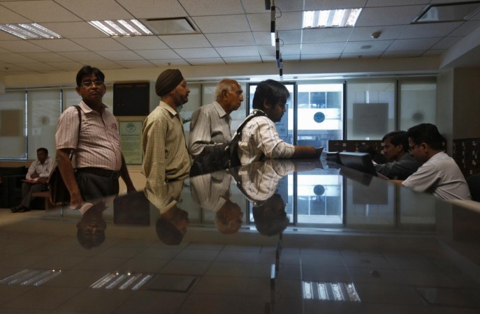 People line to submit their papers inside the Income Tax office in New Delhi. Tax