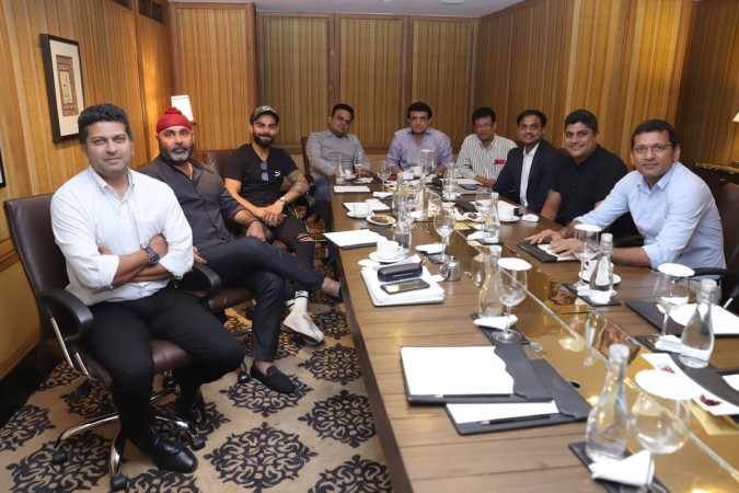 The person sitting where Anushka is shown in photo-shopped image is selector Gagan Khoda BCCI