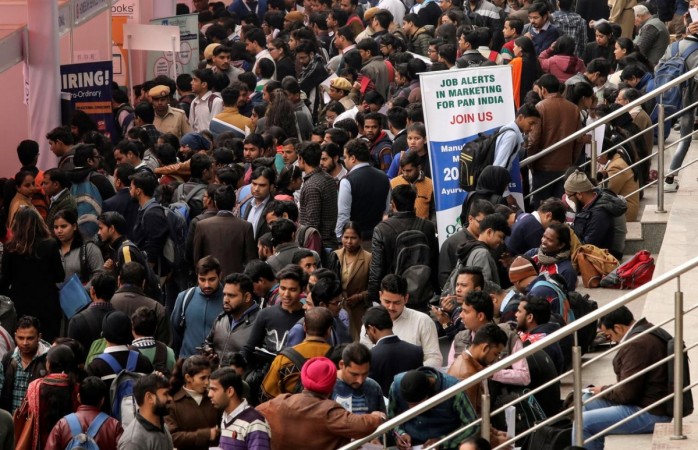 Job seekers attend a job fair organised by the employment department of the Delhi state government in New Delhi. Unemployment