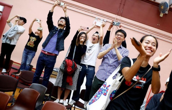 Supporters of local candidate Kelvin Lam celebrate, after it was announced that he won the local council elections in his district, at a polling station in South Horizons West district in Hong Kong, China November 25, 2019. Hong Kong elections