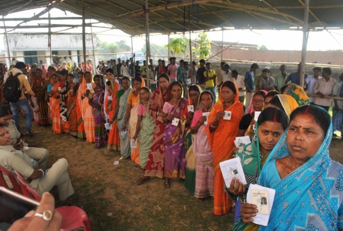 Women queue-up to cast their votes at a polling booth during 2019 Lok Sabha Election re-polls in Bankura, West Bengal on May 19, 2019. bengal bypolls