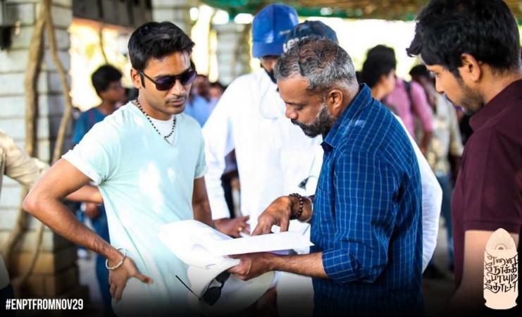 Dhanush with Gautham Menon on the sets of their movie Enai Noki Paayum Thota. Dhanush with Gautham Menon on Enai Noki Paayum Thota Sets