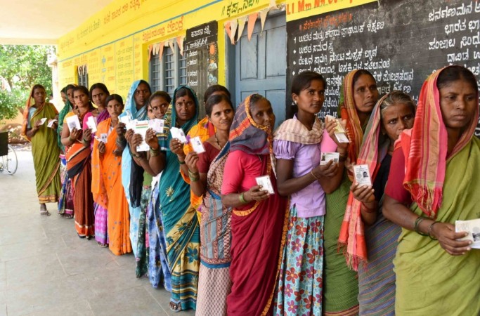 Raichur: Women voters wait in a queue to cast their votes for the third phase of 2019 Lok Sabha elections, at a polling station in Karnataka's Raichur, on April 23, 2019 Raichur: Women voters wait in a queue to cast their votes for the third phase of 2019 Lok Sabha elections, at a polling station in Karnataka's Raichur, on April 23, 2019