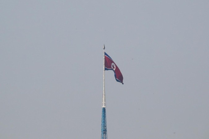 A North Korean flag flutters on top of the 160-metre tall tower at North Korea's propaganda village of Gijungdong. North Korea