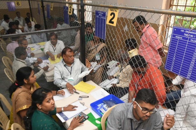 Polling officials busy counting votes cast. Karnataka