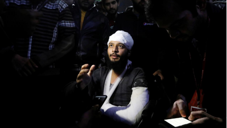 Hisham Siddiqui, a Jamia Millia Islamia university student, who was injured during a protest on Sunday, talks to media outside a hospital in New Delhi, India, December 16, 2019. Picture taken December 16, 2019. jamia protest