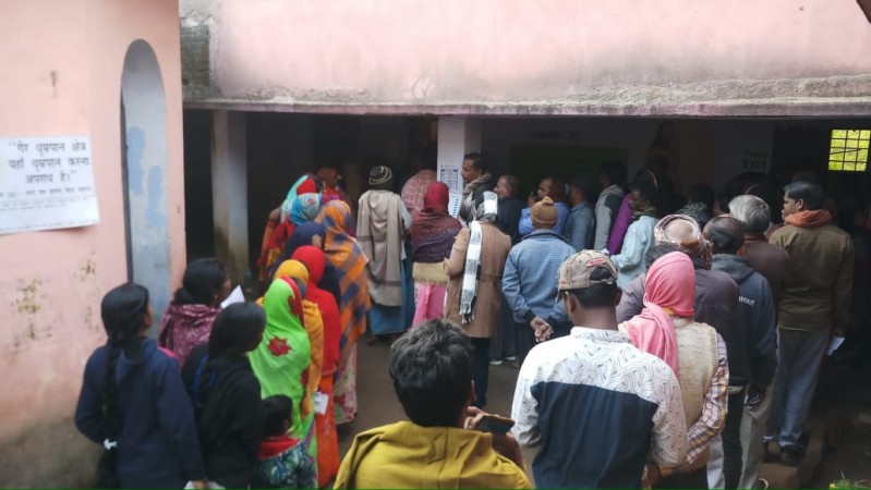 Voters queue up at a polling station to cast their votes during the fourth phase of Jharkhand Assembly elections. Jharkhand elections