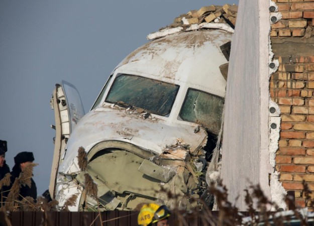 Emergency and security personnel are seen at the site of the plane crash near Almaty, Kazakhstan. Kazakhstan plane crash