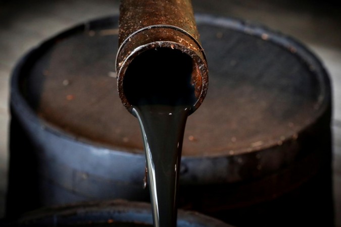 Oil pours out of a spout from Edwin Drake's original 1859 well that launched the modern petroleum industry at the Drake Well Museum and Park in Titusville, Pennsylvania US. Oil