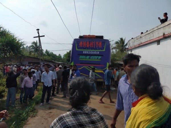 Ganjam: Locals gather at the site where a bus came in contact with an 11 KV power transmission line, electrocuting five passengers to death and injuring over 30, in Odisha's Ganjam district on Feb 9, 2020. The accident took place near Nandarajpur under the Golanthara police limits of Ganjam district. odisha bus