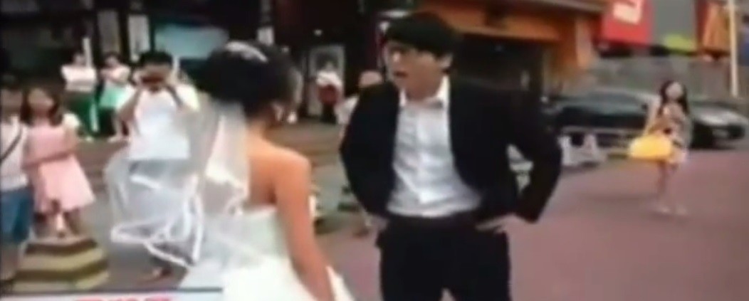 Chinese bride and groom fight in the middle of Dongmen Old Street in Shenzhen. Chinese bride prank goes wrong