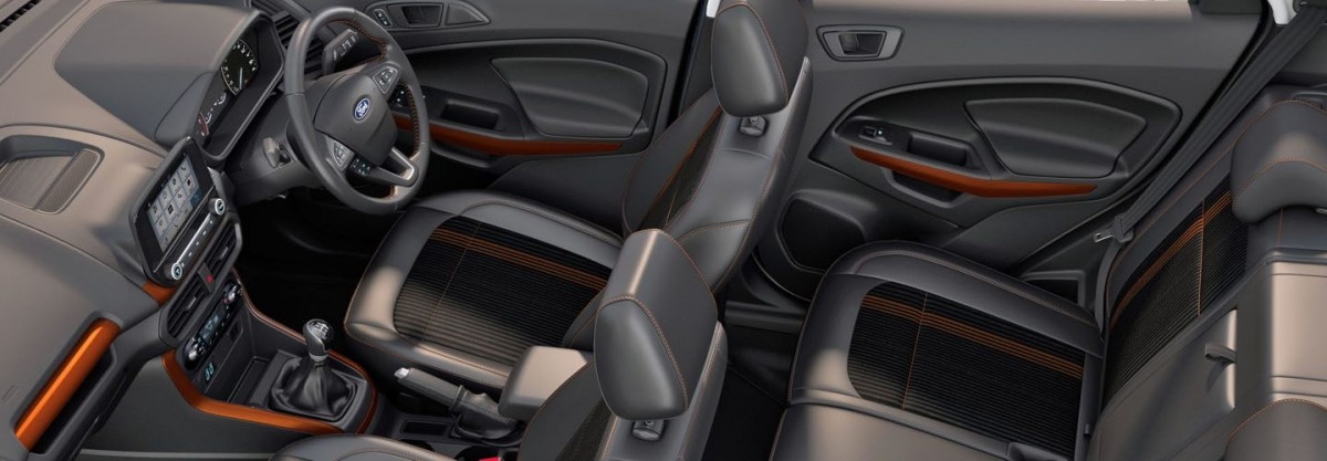 All-black interior is perfectly contrasted with orange touches. 2018 Ford EcoSport S