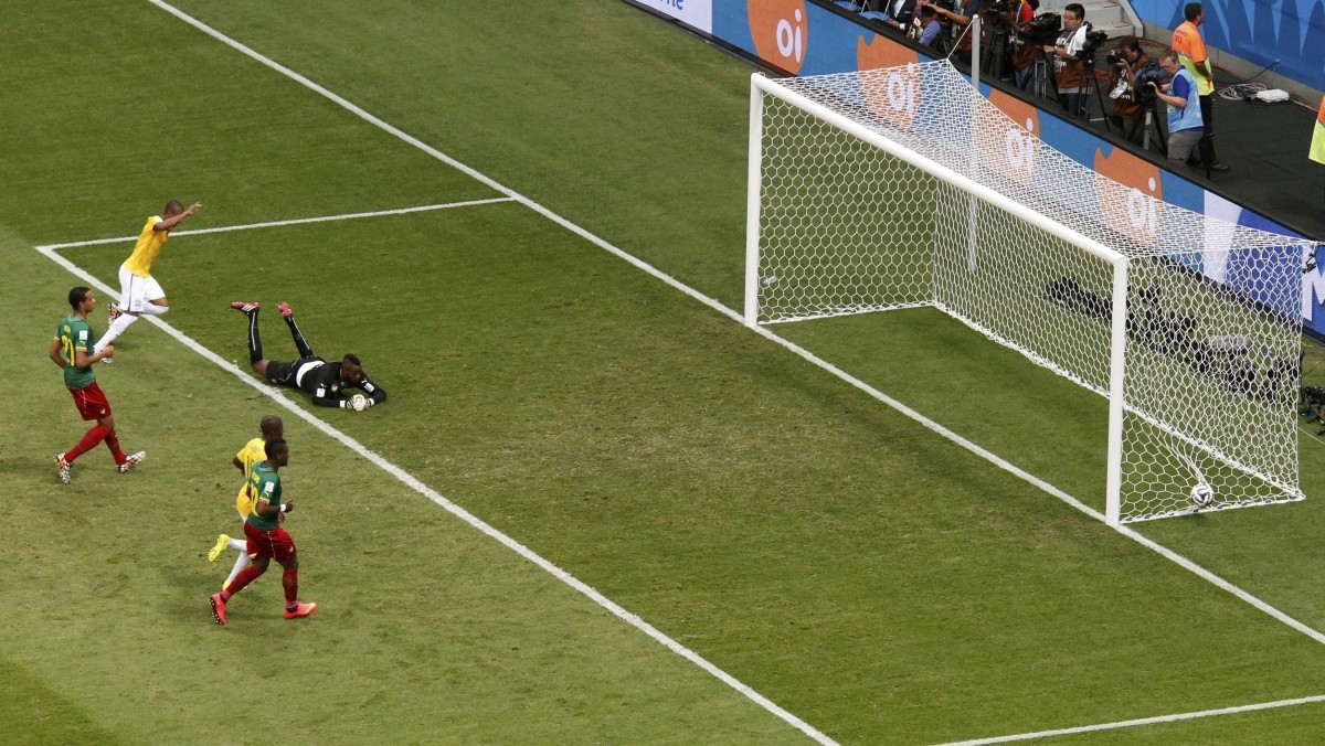 Brazil's Fernandinho scores the team's fourth goal against Cameroon during their 2014 World Cup Group A match at the Brasilia national stadium in Brasilia Cameroon v Brazil