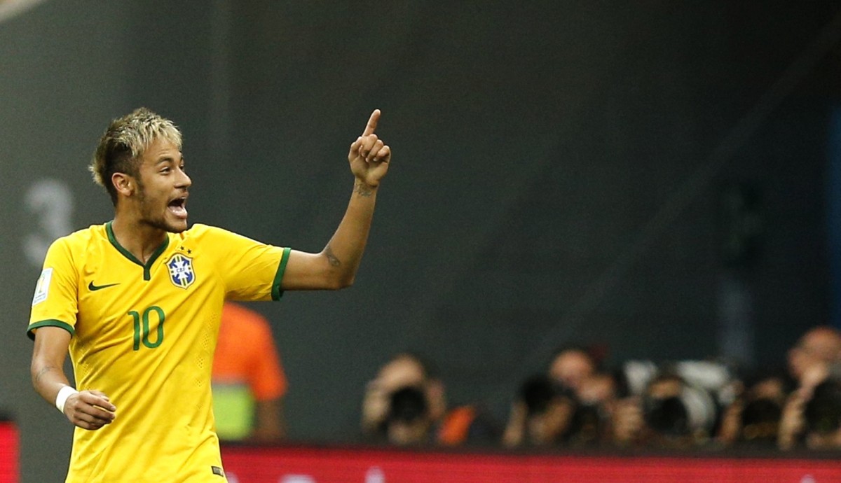 Brazil's Neymar celebrates after his second goal during the 2014 World Cup Group A match between Cameroon and Brazil at the Brasilia national stadium Cameroon v Brazil
