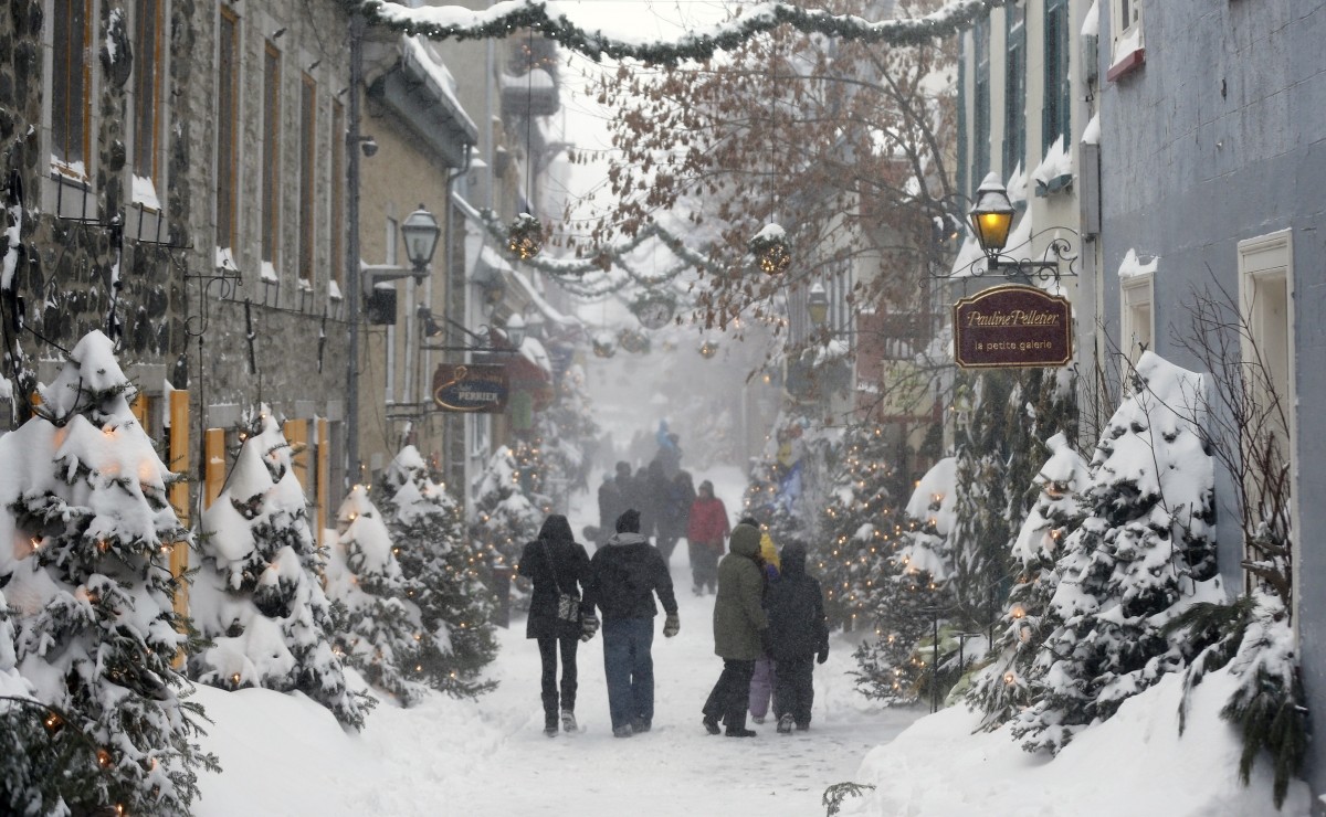 People walk in the old town during a snowstorm in Quebec City, Canada Quebec City, Canada