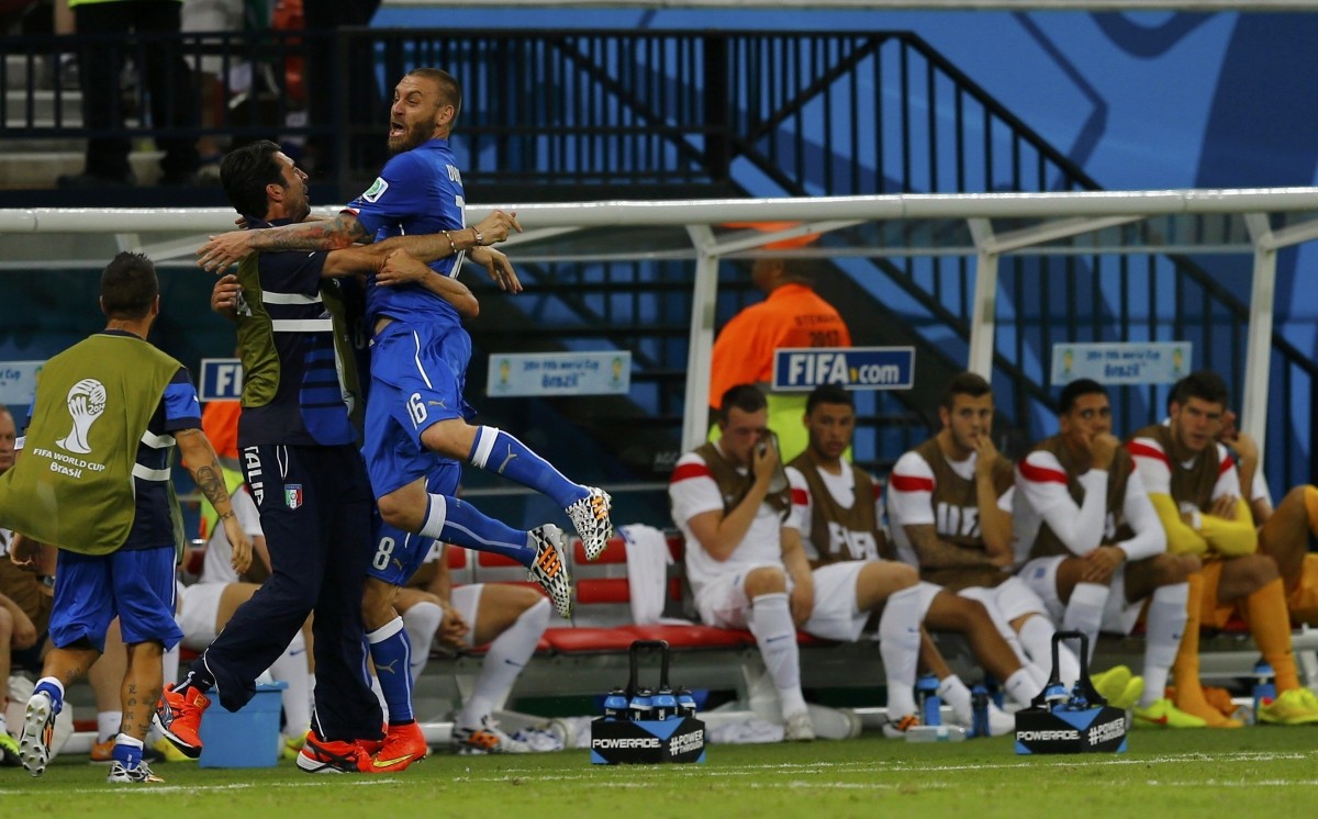 Italy's Marchisio and Itlay's De Rossi celebrate Marchisio's goal in front of the England bench Italy v England