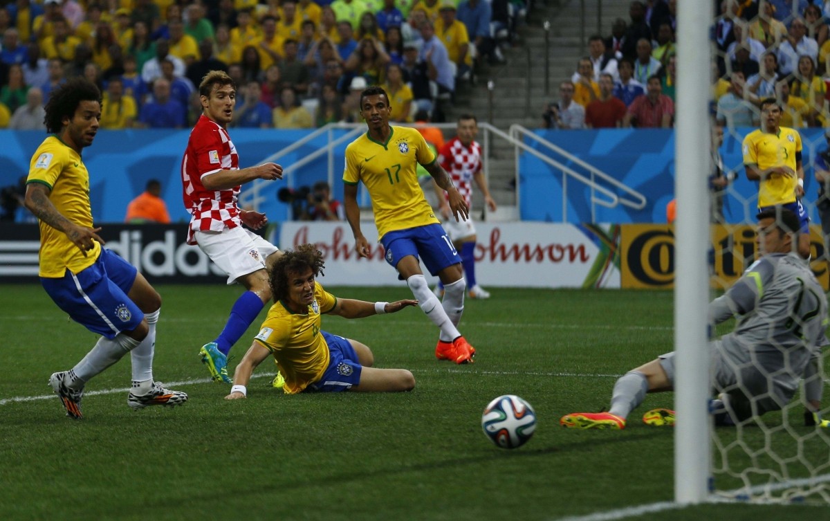Brazil's Marcelo scores his own goal as Croatia's Jelavic, Brazils' Luiz, Gustavo and Cesar look on Brazil v Croatia