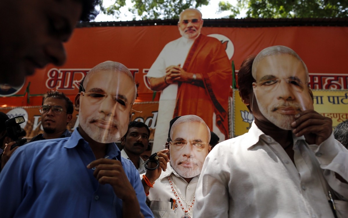 Supporters of Hindu nationalist Narendra Modi, prime ministerial candidate for India's main opposition Bharatiya Janata Party (BJP), wear masks depicting Modi outside their party office in Mumbai Supporters of Hindu nationalist Narendra Modi, prime ministerial candidate for India's main opposition Bharatiya Janata Party (BJP), wear masks depicting Modi outside their party office in Mumbai