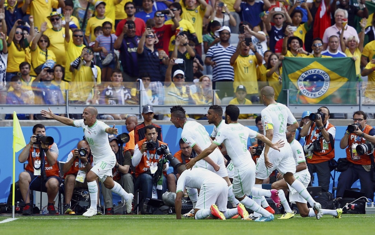 Algeria's Feghouli celebrates with his teammates after scoring his penalty against Belgium during their 2014 World Cup Group H soccer match at the Mineirao stadium in Belo Horizonte Belgium v Algeria