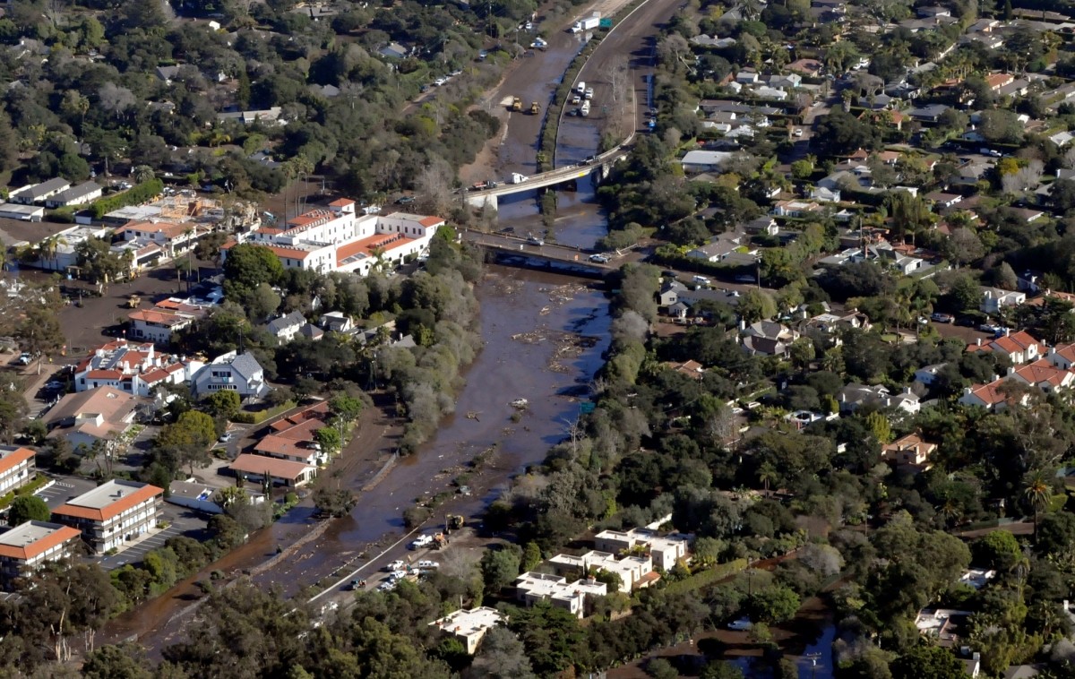 An aerial photo showing north and south bound lanes of Hwy 101 flooding and mud slides due to heavy rains in Montecito, California. California mudslides