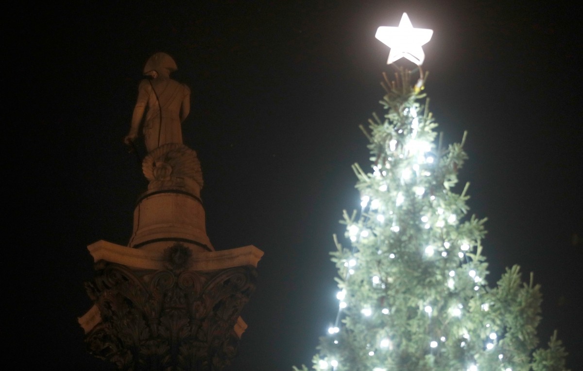 The Trafalgar Square Christmas tree, a gift from Norway, is lit during a ceremony Christmas tree