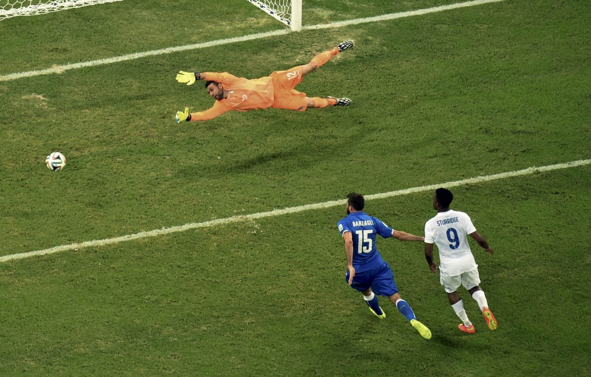 Italy's goalkeeper Sirigu dives for the ball Italy v England