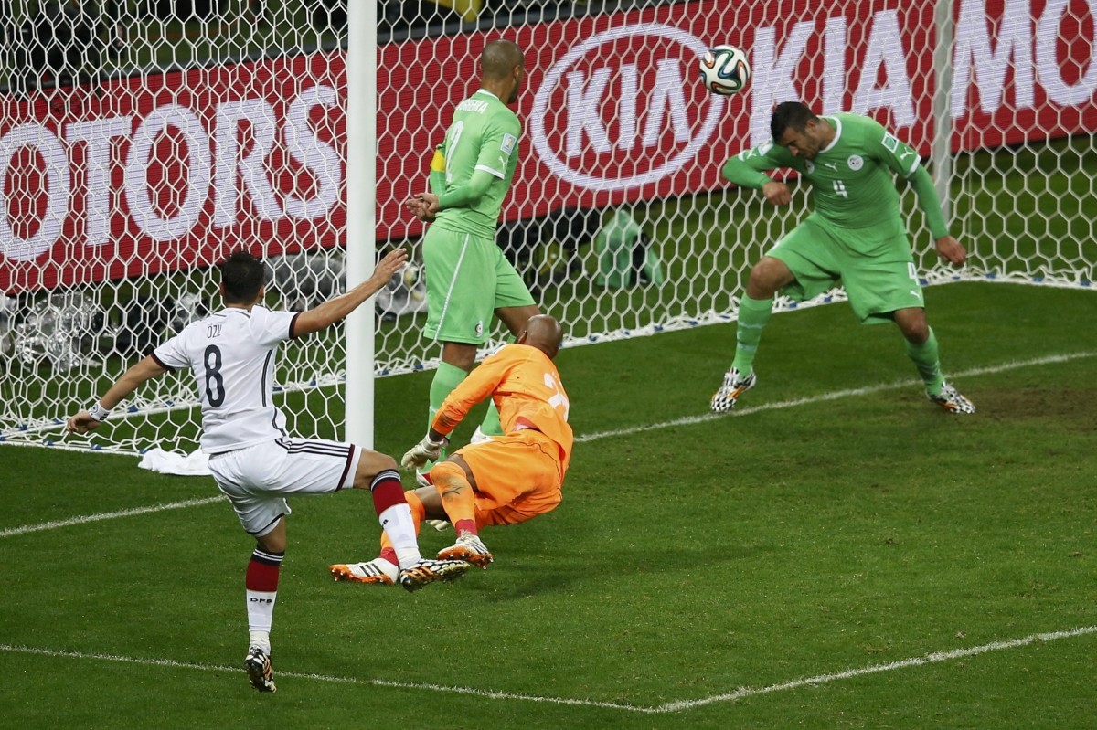 Germany's Ozil scores against Algeria during their 2014 World Cup round of 16 game at the Beira Rio stadium in Porto Alegre Germany vs Algeria