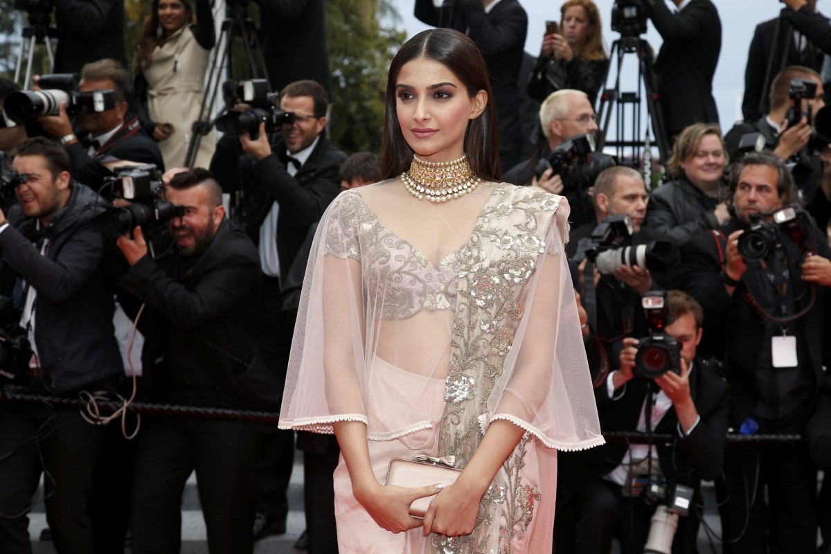 Sonam Kapoor poses on the red carpet as she arrives for the screening of the film Sonam Kapoor