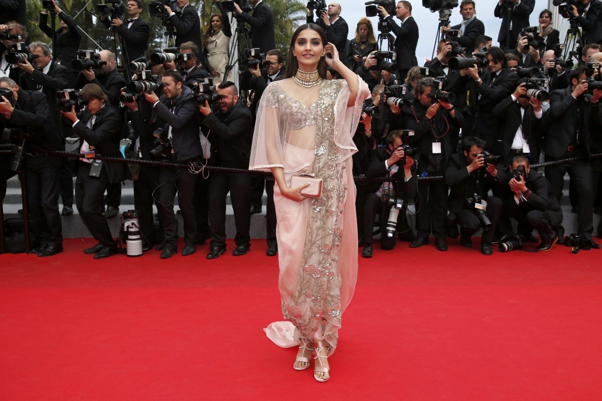 Sonam Kapoor poses on the red carpet as she arrives for the screening of the film Sonam Kapoor