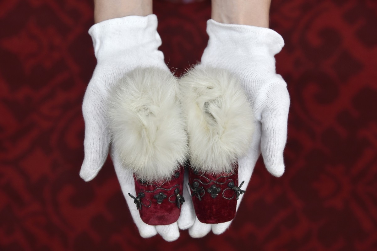 A pair of fur-lined velvet red boots worn by Prince Albert Edward in 1842. Prince Albert Edward