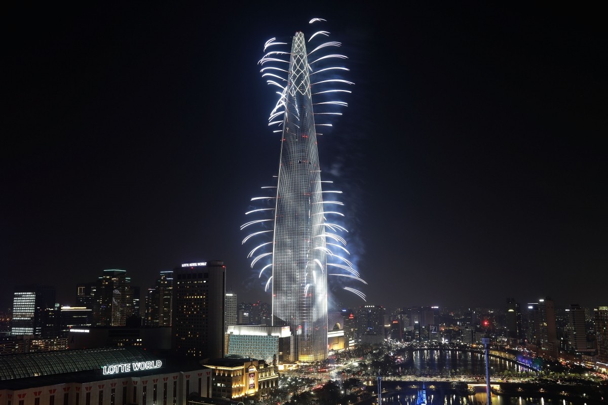 Fireworks illuminate on the Lotte World Tower to commemorate the opening on April 2, 2017, in Seoul, South Korea. Lotte World Tower