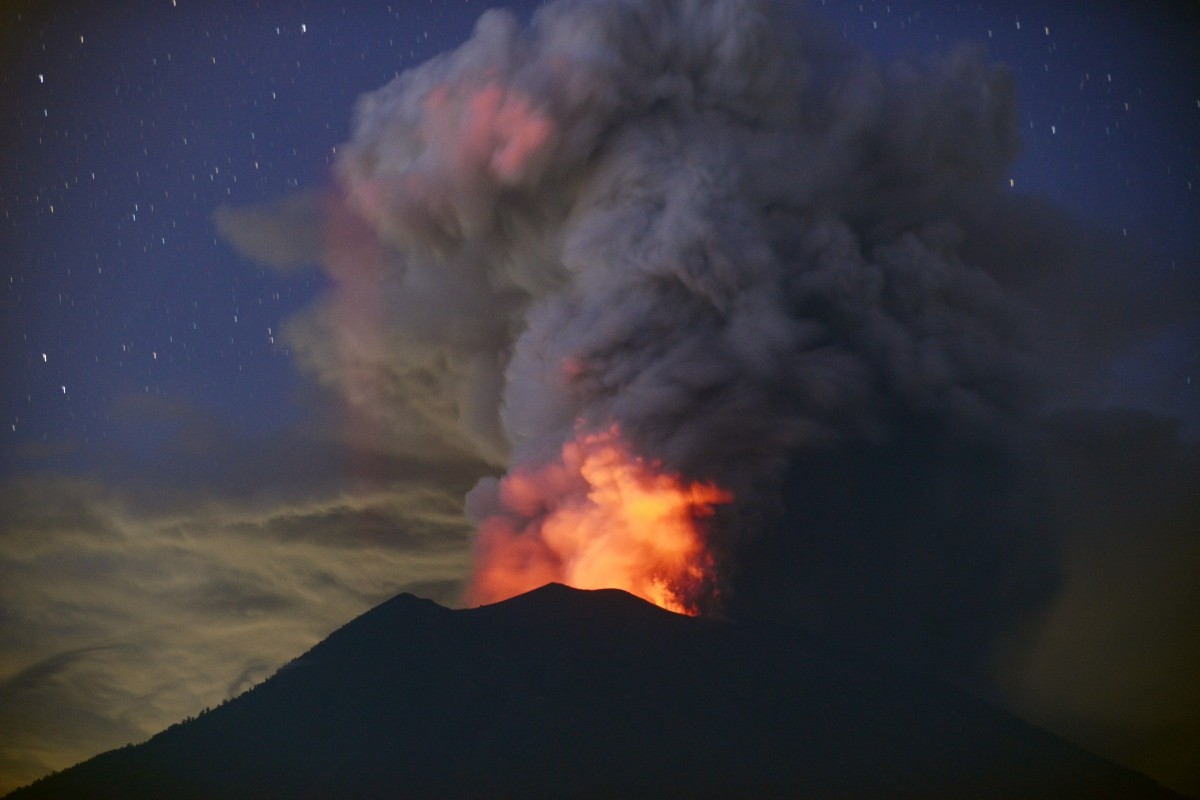 A general view shows Mount Agung erupting seen at night Bali volcano