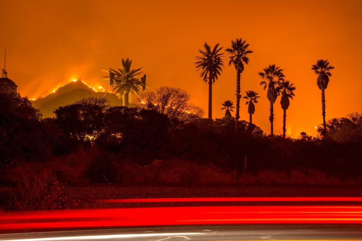 The Thomas Fire burns along a hillside near Santa Paula, California, on December 5, 2017 Thomas Fire